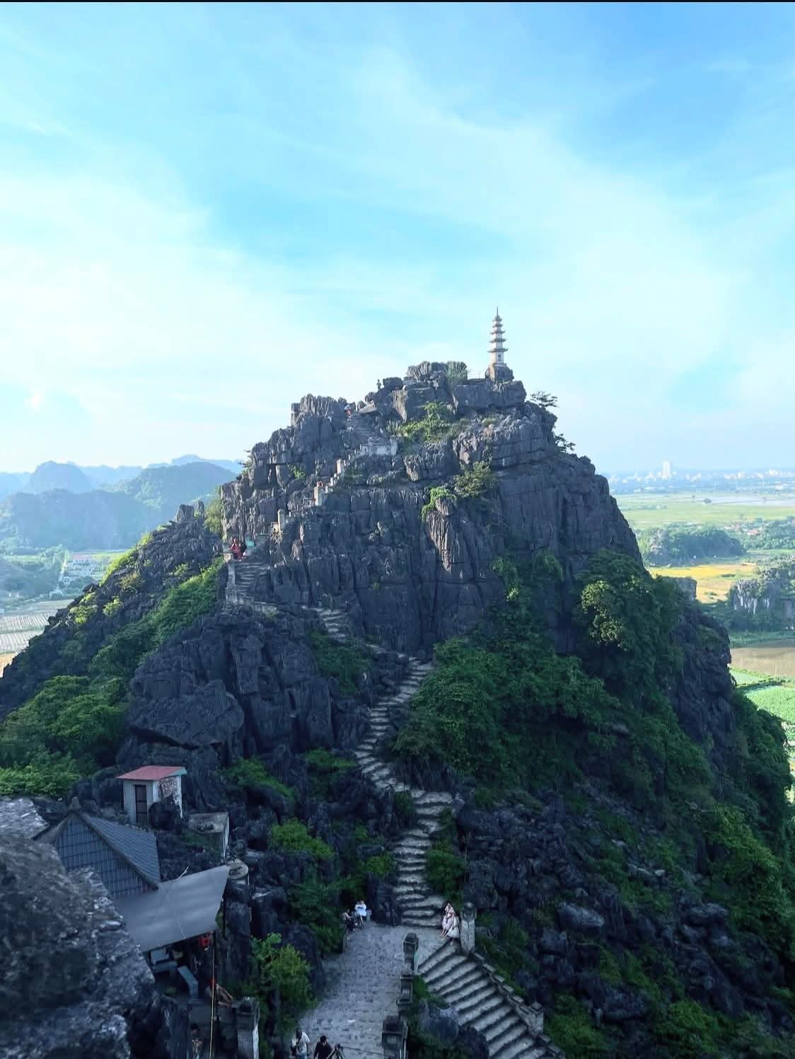 View from Mua Cave summit Ninh Binh rice paddies and karst valley — Vietnam Unlock