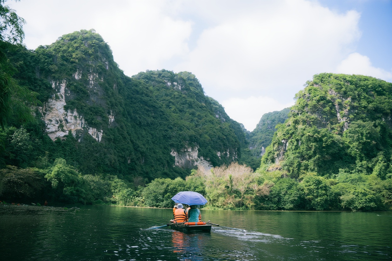 Wooden boat passing limestone karst on Ba Be Lake — Pac Ngoi village runs most of the boat tours