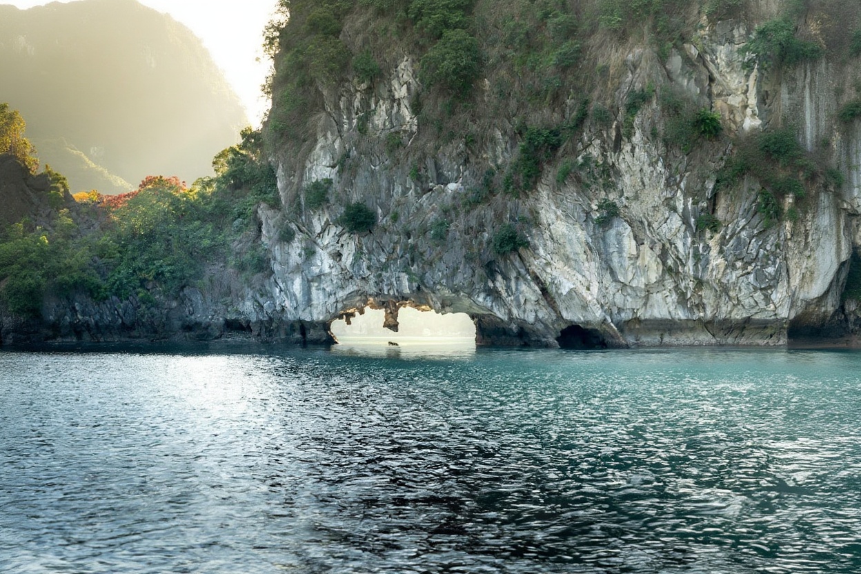 Kayaking through a karst arch in Lan Ha Bay — this is what Cat Ba access gives you that the big Ha Long cruises don't