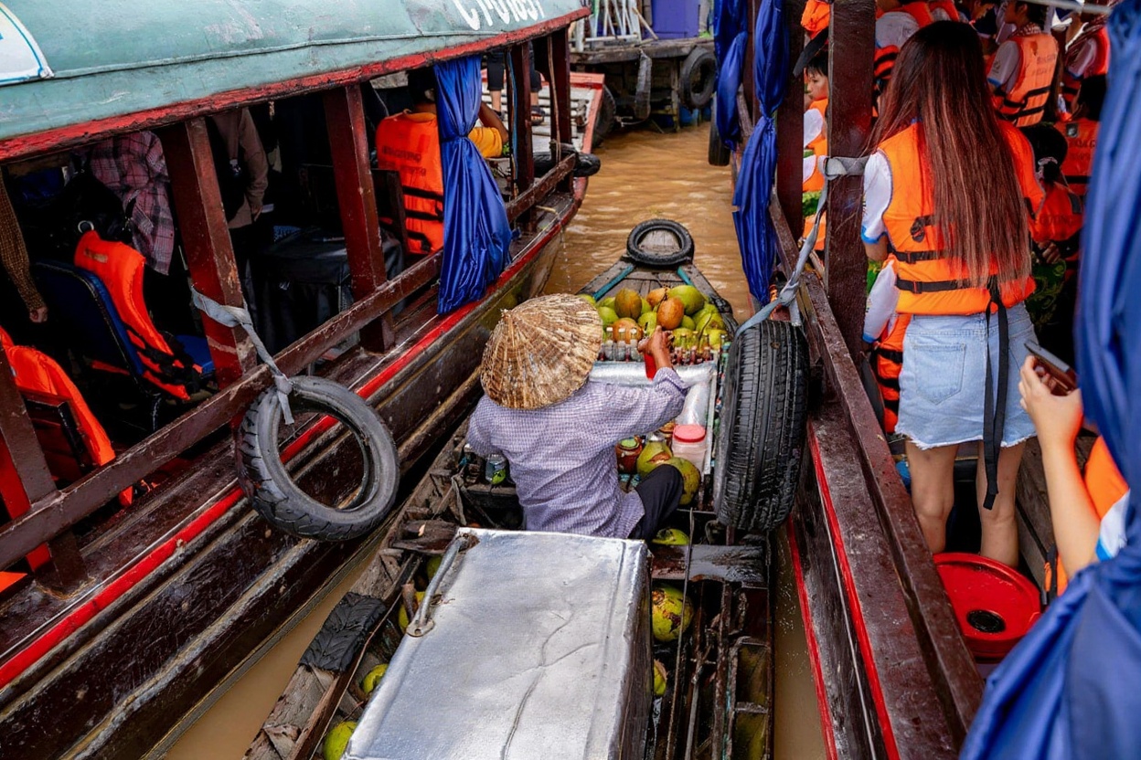 Cai Rang floating market at dawn — the wholesale traders leave by 8am