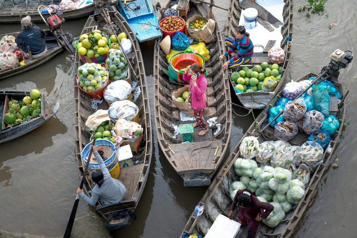 Cai Rang at first light — hundreds of wooden boats trading wholesale produce on the Cai Rang River
