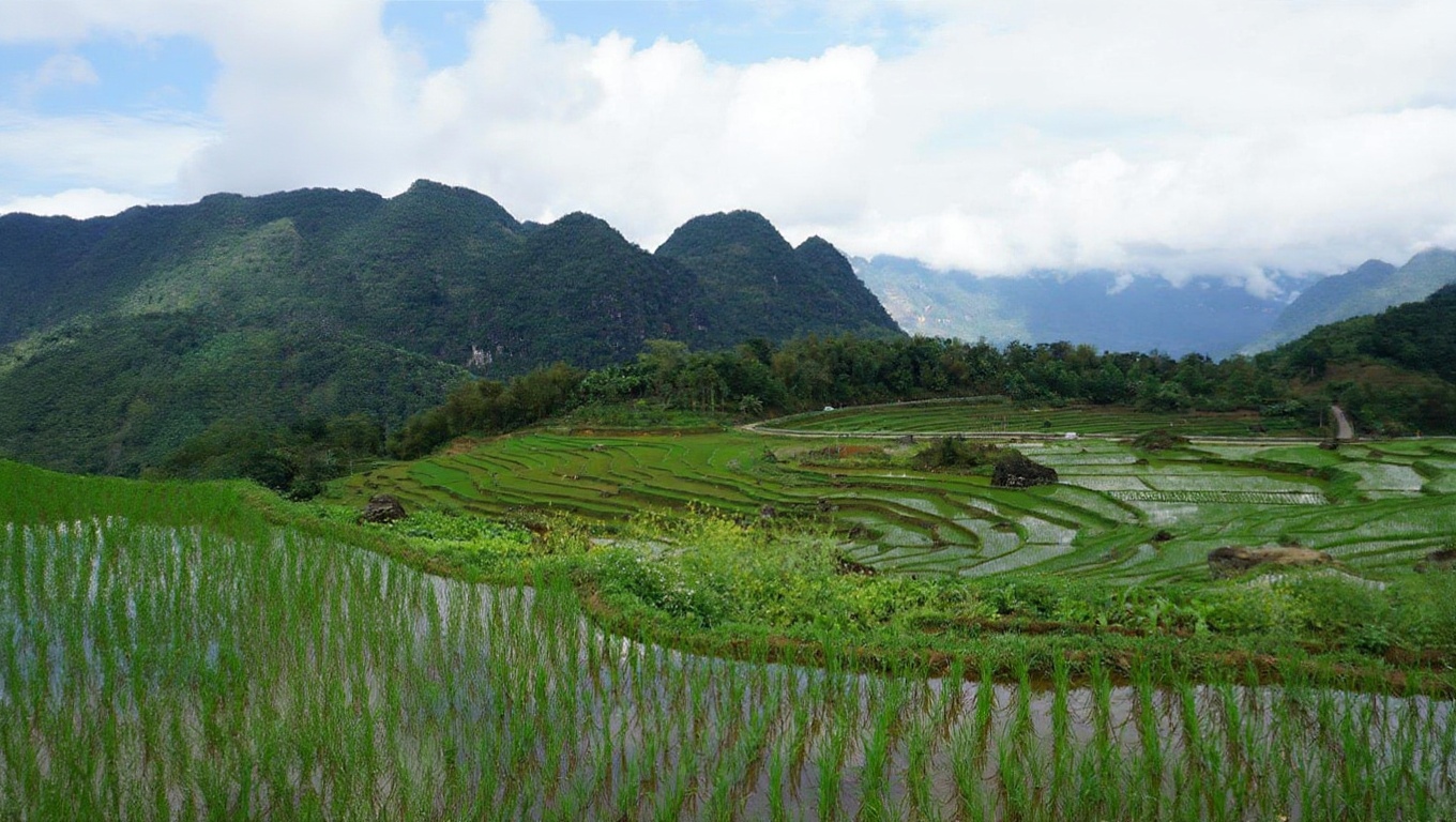 Mai Chau's flat valley (left approach) vs Pu Luong's terraced slopes — different landscapes, different experiences
