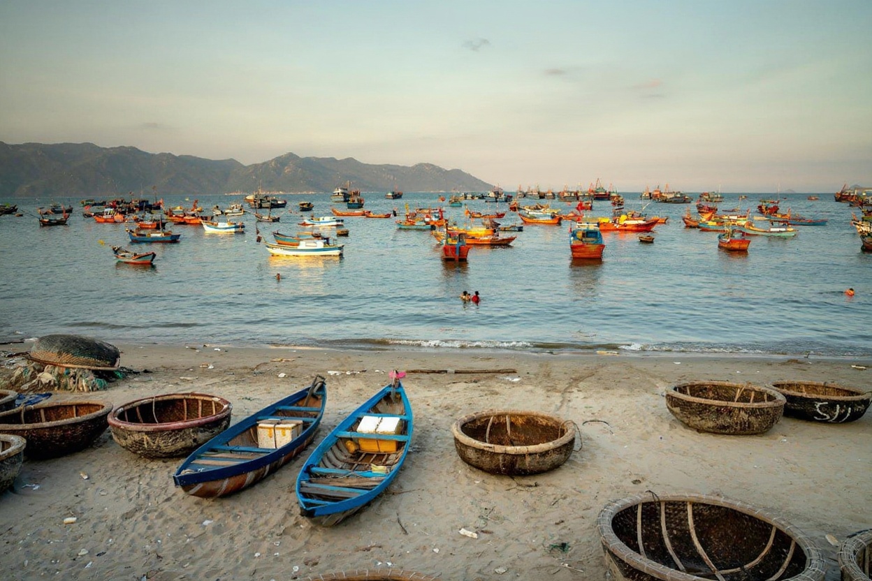Bai Xep at low tide — fishing boats hauled up, village still quiet