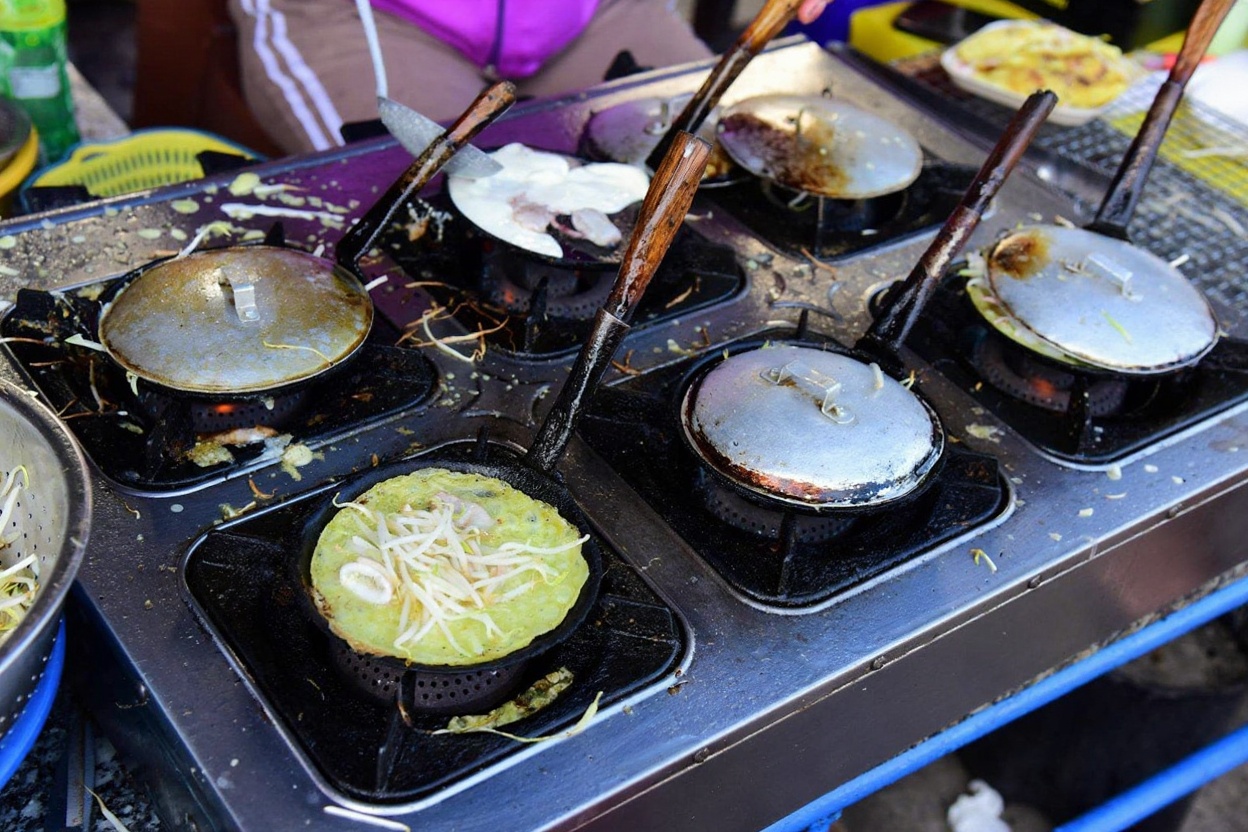 Bánh xèo tôm nhảy — the shrimp are still moving when they hit the pan
