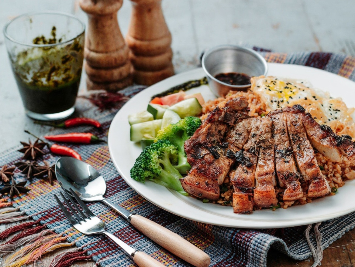 Cơm tấm: broken rice, grilled pork chop, fried egg, pork skin, pickles