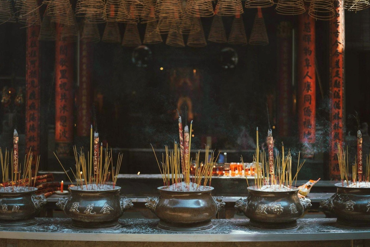 Jade Emperor Pagoda — the incense smoke in the inner chamber is thick enough to taste