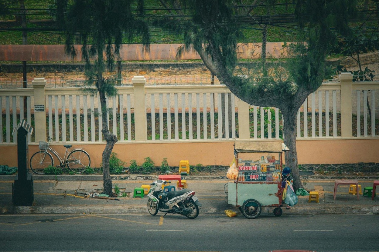 A proper bánh mì cart — the bread is baked fresh twice daily and the ratio of filling to bread is everything