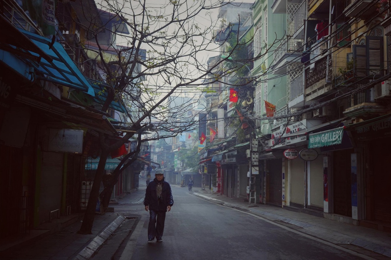 Hanoi mornings — bun cha smoke, motorbikes, and coffee before 8am