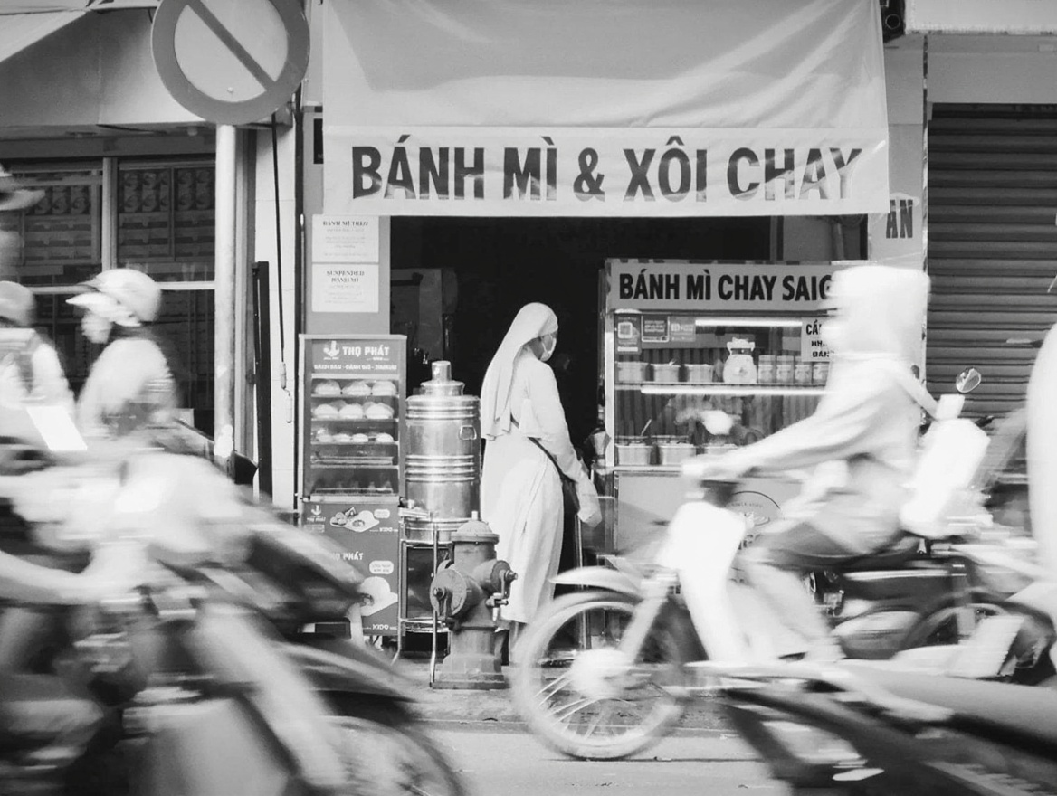 Bánh mì at a street cart — HCMC's version is crunchier than most and Bánh Mì Huỳnh Hoa on Lê Thị Riêng is the benchmark