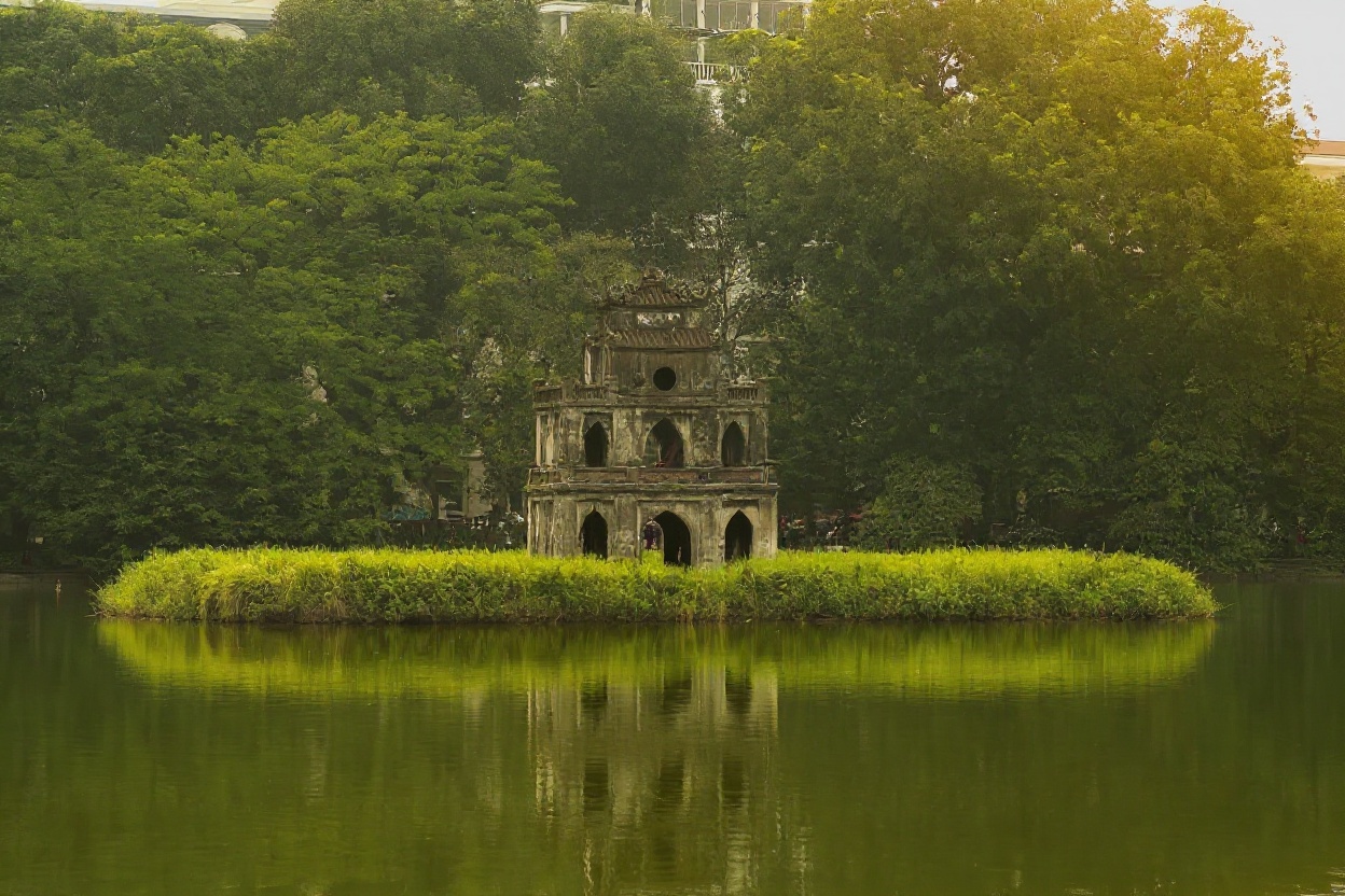 Hoan Kiem Lake at dawn — the tortoise tower is more impressive before the tour groups arrive