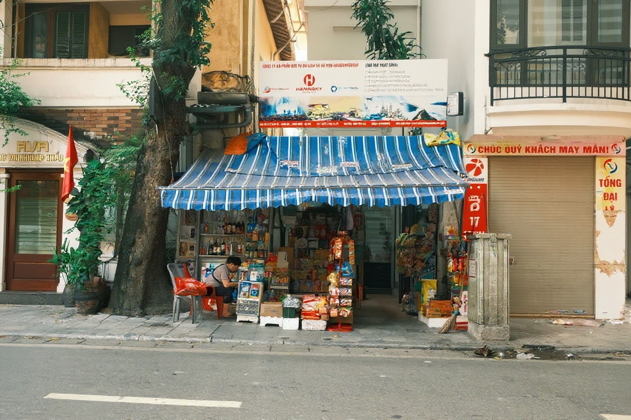 Corner shop in Hanoi — bottled water costs 5,000-10,000 VND, not 30,000 from the hotel mini-fridge