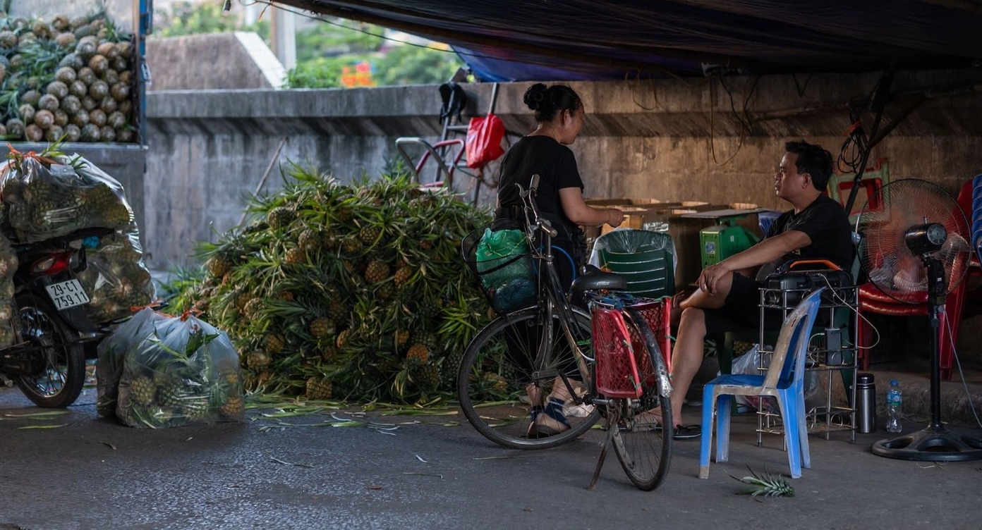 Hanoi street food scene in November — cool enough to stand next to the wok